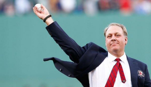 Former Boston Red Sox pitcher Curt Schilling #38 throws out the first pitch after being inducted into the Red Sox Hall of Fame prior to the game against the Minnesota Twins during the game on August 3, 2012.